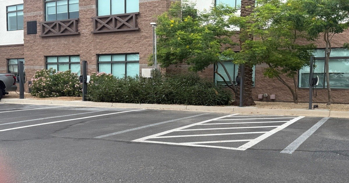 Holiday Inn Suites Goodyear Tesla Charging with 5 FREE NACS Level 2 destination chargers near Phoenix Raceway Goodyear Ballpark Spring Training Arizona West Valley